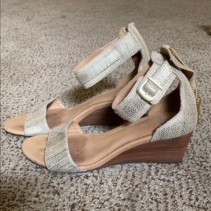 Lightly worn Ugg wedge gold sandals heels. Size 7